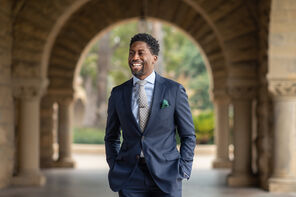 Image of Lerone A. Martin laughing in Stanford arcade