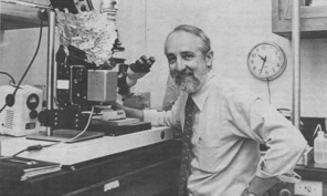 Image of Norman K. Wessells at microscope