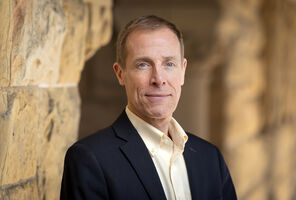 Portrait of James Gross in the Stanford arcade