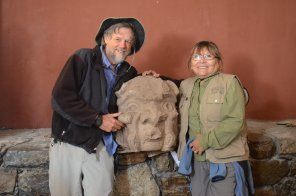 John Rick and Rosa Mendoza Rick stand with statue between them