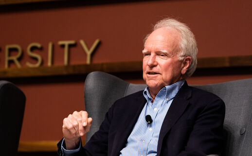 Image of Robert E. Hall speaking on a panel at Stanford University