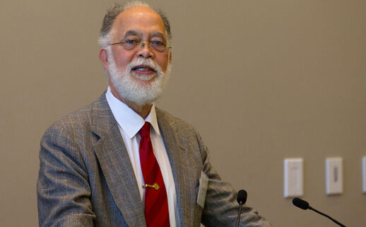 Photo of John R. Rickford at a podium