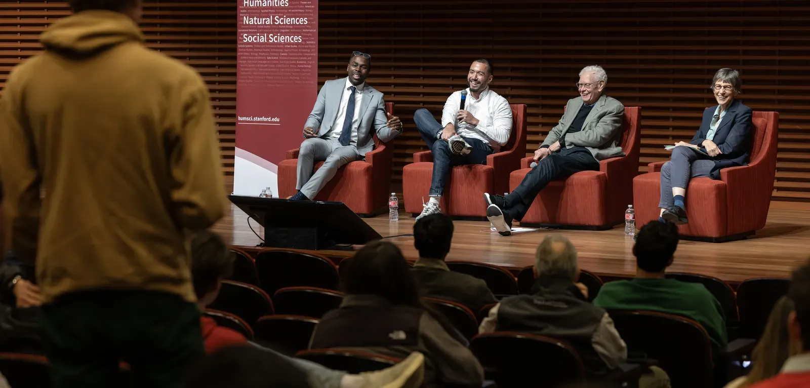 Photo of Daniel Fryer, Christopher Lewis, Paul Brest, and Debra Satz at Democracy and Disagreement