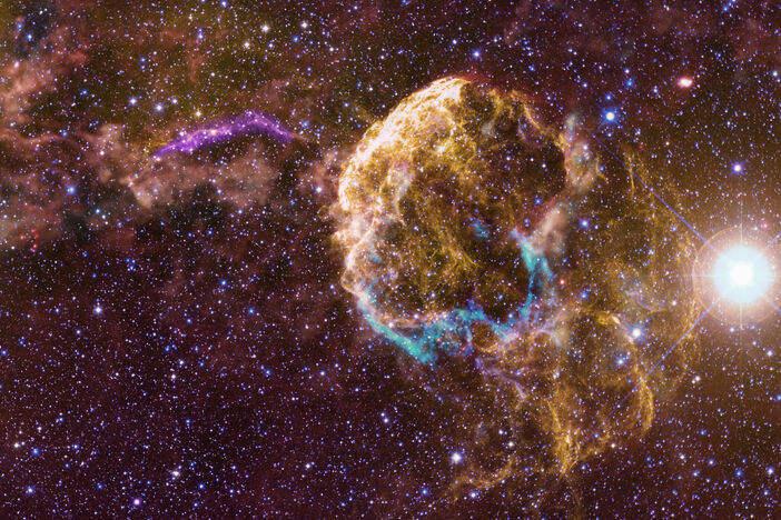 Infrared, visible, and ultraviolet image of the area around the Jellyfish Nebula 
