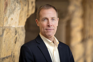 Portrait of James Gross in the Stanford arcade