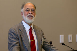 Photo of John R. Rickford at a podium
