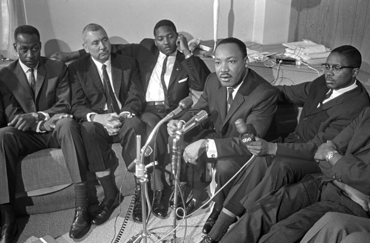 MLK Jr. surrounded by microphones. Atlanta, GA, 1966: Alabama candidate press conference