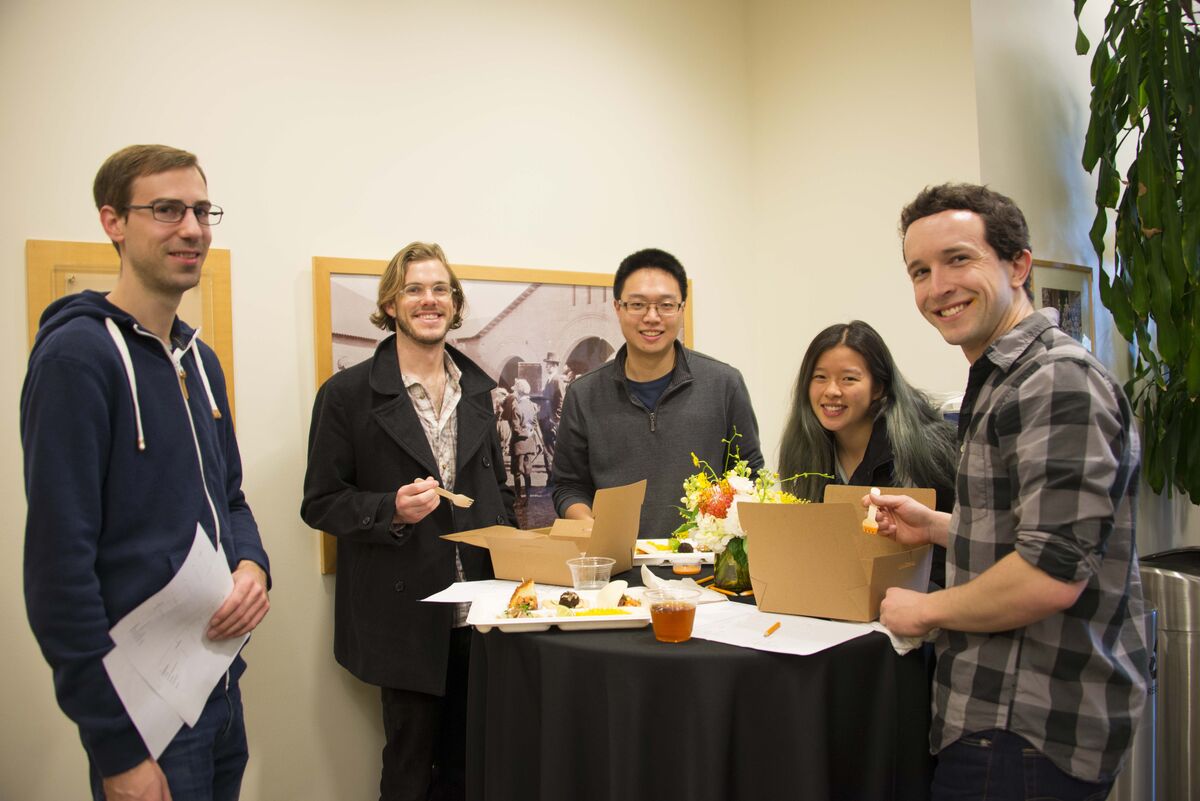 Stanford students trying sample dishes from Heritage Eats.