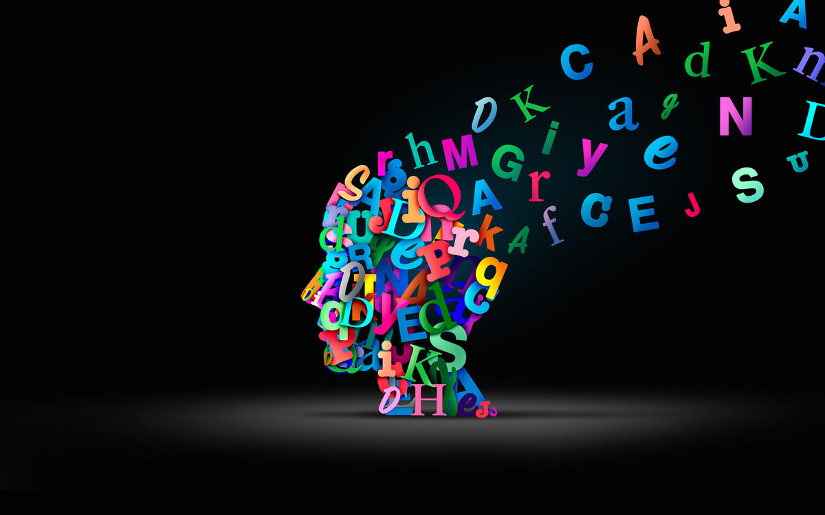 an illustration showing a head in profile made of colorful letters