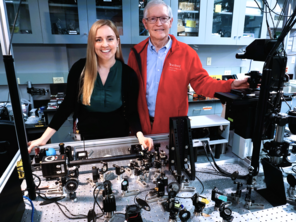  an image of Michelle Kueppers and W.E. Moerner standing in front of the iISM microscope