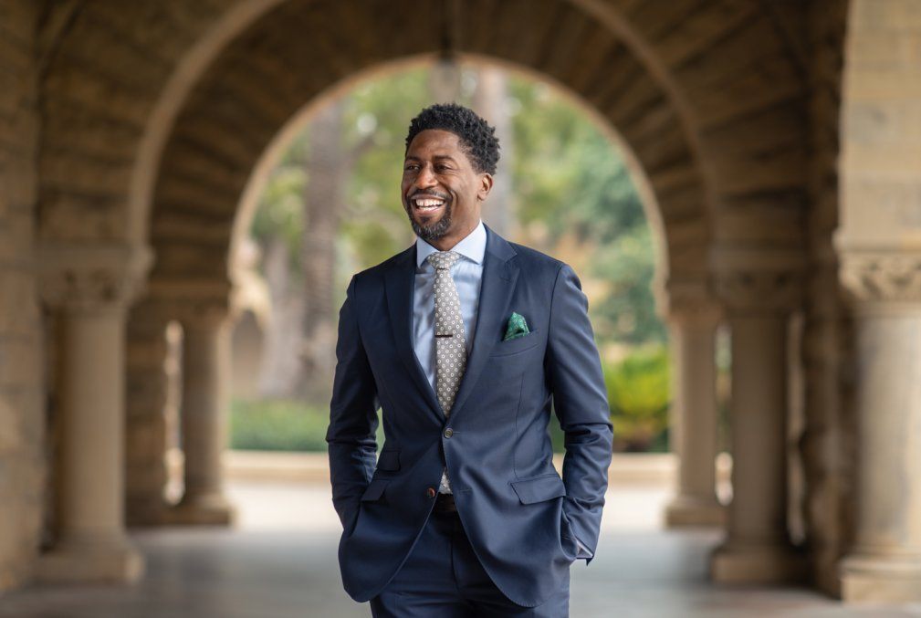 Image of Lerone A. Martin laughing in Stanford arcade