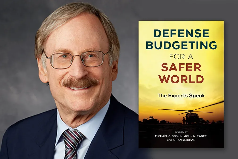 Photo of Michael J. Boskin wearing glasses and smiling and an image of the cover of the Defense Budgeting for a Safer World