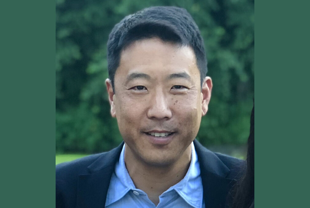 Photo of Harold Hwang wearing a dark blazer over a light-blue collared shirt