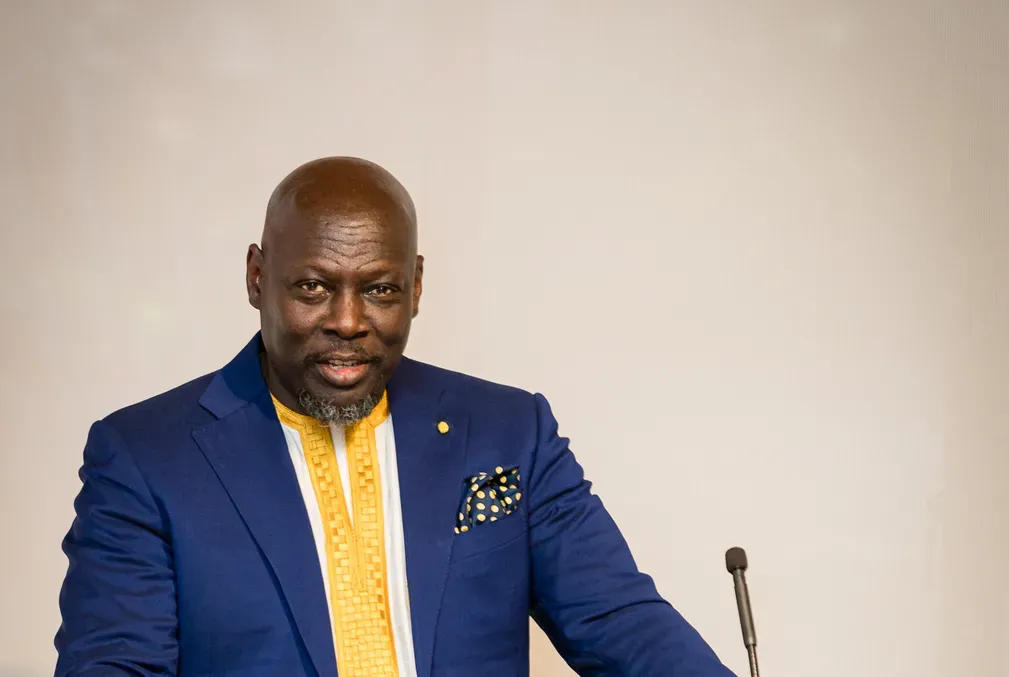 Ato Quayson speaking from behind a podium