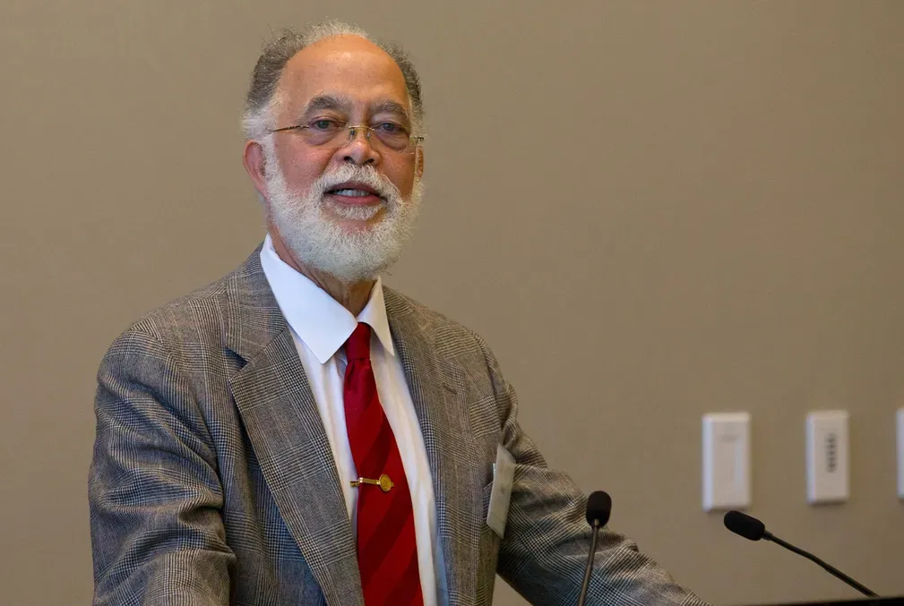 Photo of John R. Rickford at a podium